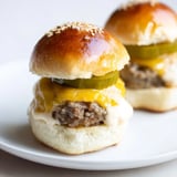 Savory sliders – mini hamburgers – show the juicy beef patties nestled in soft buns, ready to eat.