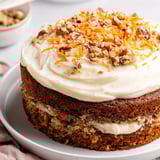Warm, spiced carrot cake, layered with cream cheese frosting, a classic American dessert.