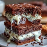 Decadent brownie mix cookies featuring a hidden cream cheese center, offering a delightful contrast of textures and flavors.