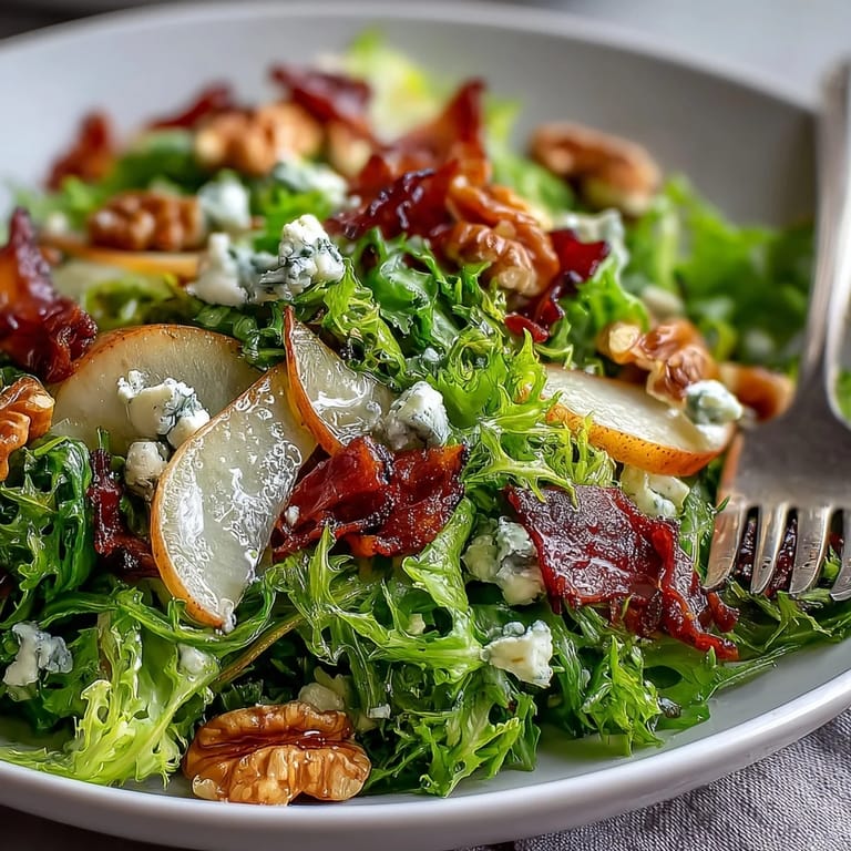Fresh frisée lettuce tossed with sweet pears, crumbled blue cheese, and a tangy vinaigrette for a light lunch.
