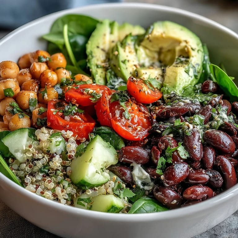 Colorful Three-Bean Power Bowl served in a rustic bowl, garnished with fresh cilantro and toasted pumpkin seeds.