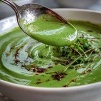 Vibrant Spinach Coriander Lemongrass Soup creamy with fresh herbs and lime, ready to enjoy.